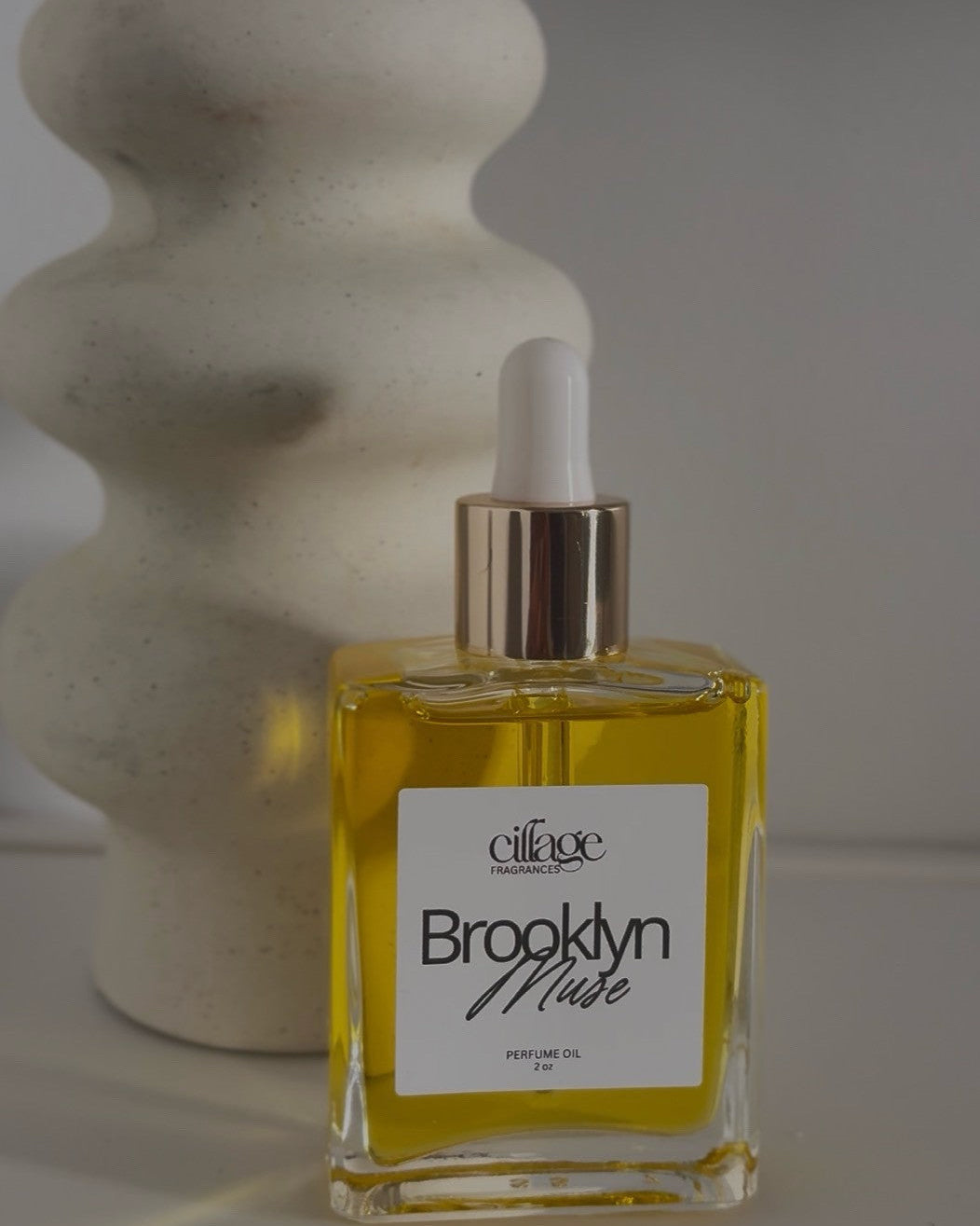 A bottle of Cillage Brooklyn Muse with a white dropper top in a rectangle bottle